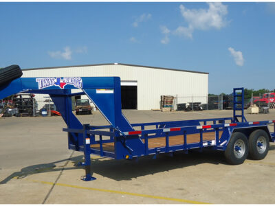 Texas Bragg gooseneck trailer parked outdoors, showcasing heavy-duty construction and durable design available for sale at RentX in Tyler, Texas.