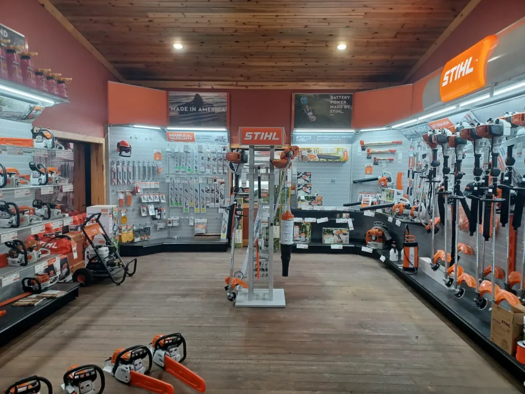 STIHL equipment showroom at RentX in Lindale, Texas, with chainsaws, trimmers, blowers, mowers, accessories, and other outdoor power equipment on display.